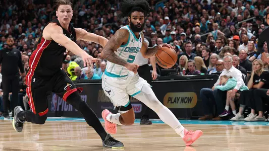 CHARLOTTE, NC - APRIL 14: Coby White #3 of the Charlotte Hornets dribbles the ball during the game against the Miami Heat during the Play-In Tournament on April 14, 2026 at Spectrum Center in Charlotte, North Carolina. NOTE TO USER: User expressly acknowledges and agrees that, by downloading and or using this photograph, User is consenting to the terms and conditions of the Getty Images License Agreement. Mandatory Copyright Notice: Copyright 2026 NBAE (Photo by Joe Murphy/NBAE via Getty Images)