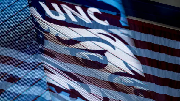 A double exposure of Rameses and the U.S. flag prior to the volleyball team playing Georgia Tech at Carmichael Arena Sunday.