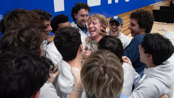 Sophomore Peter Bruk is congratulated by his teammates for capturing the ACC Championship in foil at Cameron Indoor Stadium in Durham Saturday.