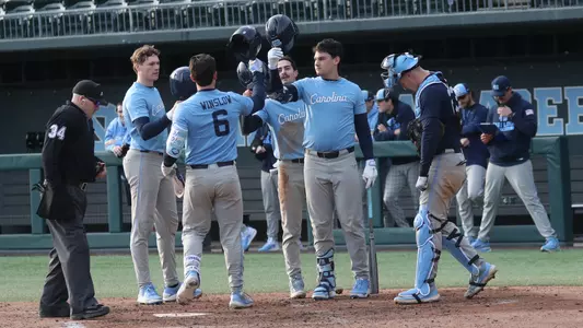 Macon Winslow (6) is greeted after his home run.