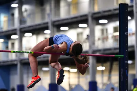 Aria Wegh Competes in the high jump at Dick Taylor