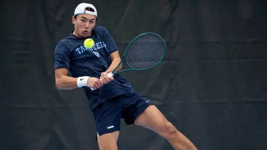 Sophomore Chris Xu returns a volley against Furman at Chewning Tennis Center Thursday.