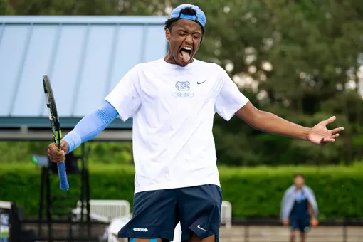 Junior Niels Ratiu reacts to winning a game against against Notre Dame during the ACC Tournament at the Cary Tennis Park Friday.