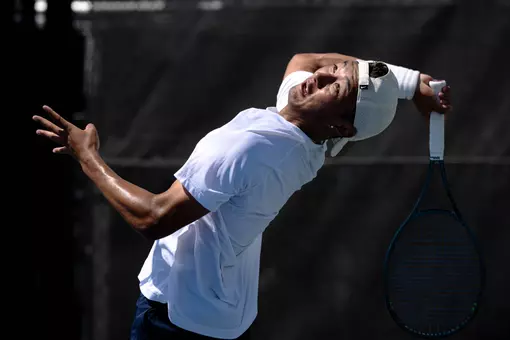 Sophomore Chris Xu prepares to serve against Notre Dame during the ACC Tournament at the Cary Tennis Park Friday.