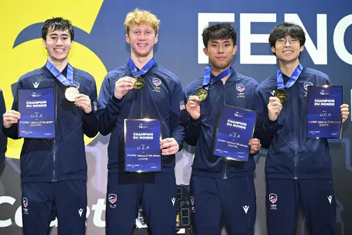 Peter Bruk Wins World Champion and poses on podium