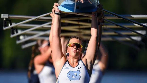 Freshman Knox Harper leads her teammates in lifting the team’s 8 after a race during the ACC Championships at Lake Wheeler Park Raleigh Friday.