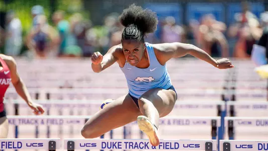 Freshman Tori Goodson clears the final hurdle in the 100-meter hurdles during the Duke Twilight meet at Morris Williams Stadium in Durham Sunday.2