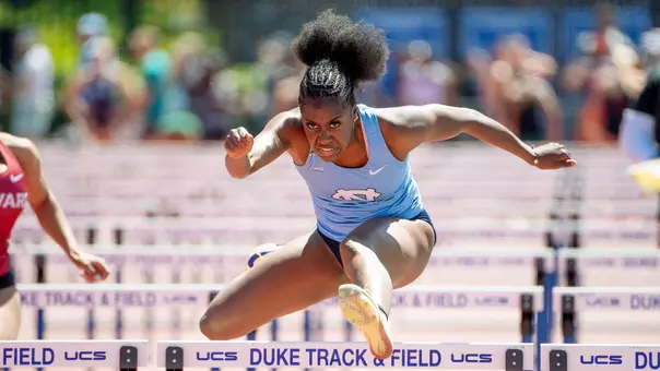 Freshman Tori Goodson clears the final hurdle in the 100-meter hurdles during the Duke Twilight meet at Morris Williams Stadium in Durham Sunday.2
