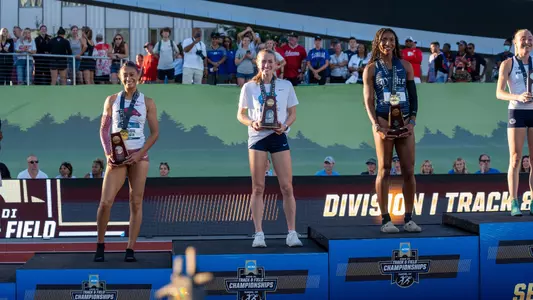 Makayla Paige poses on the podium at NCAAs