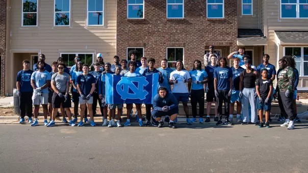 Carolina Football Volunteers with Habitat for Humanity Web Header