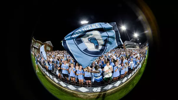 The student section cheers on the women's soccer team as they face Duke at Dorrance Field Thursday.
