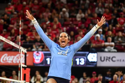 Junior Laynie Smith reacts to a kill against NC State at Reynolds Coliseum in Raleigh Friday.