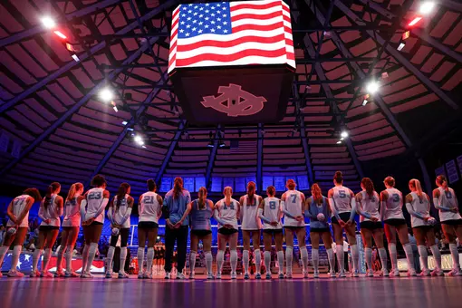 The volleyball team stand for the playing of the national anthem prior to playing James Madison Carmichael Arena Thursday evening.