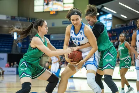 Jordan-Brown Breaks Blocks School Record in Narrow Overtime Loss Image