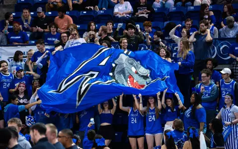 students with flag at mbb