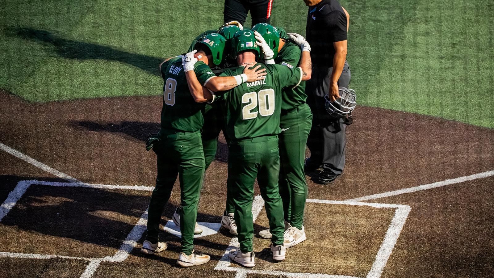 Baseball huddles around home plate after a home run