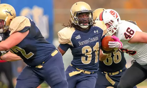 Dennis breaks rushing record in leading football to victory Image