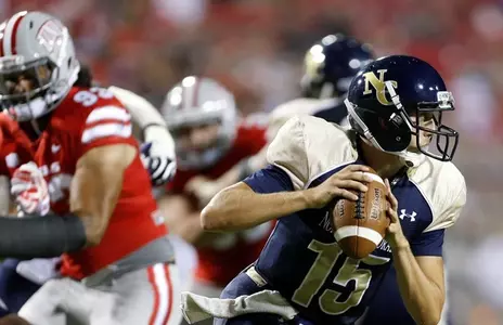 Sophomore QB, Sean Rubalcaba is flushed out of the pocket by the UNLV Defense.
