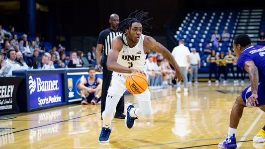 Langston Reynolds driving towards the basket