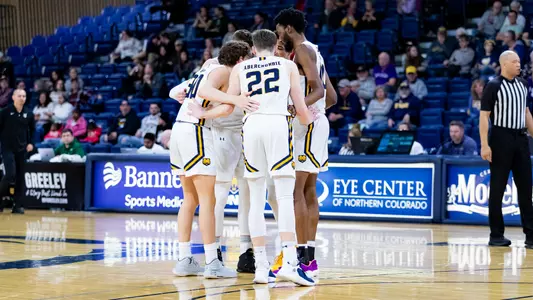 UNC players huddling on the court