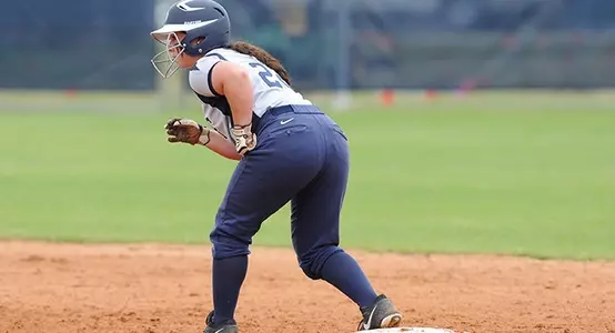 UNF softball player gets ready to steal on base