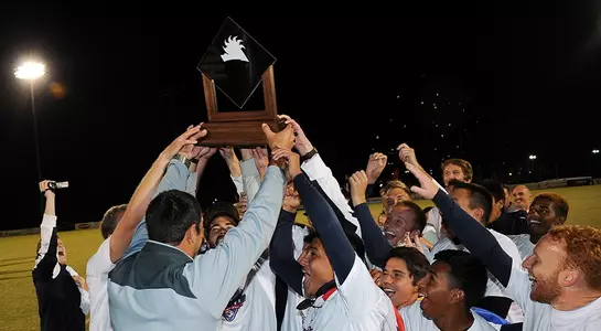 MSOC Team hoisting A-Sun Trophy