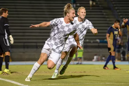 UNF men's soccer players cheer after goal