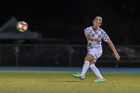 UNF men's soccer player kicked the ball