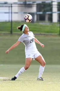 UNF women's soccer player heads the ball