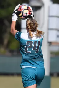 UNF women's soccer goalie catches the ball