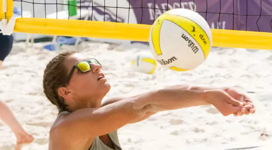 UNF beach volleyball player with a great bump pass