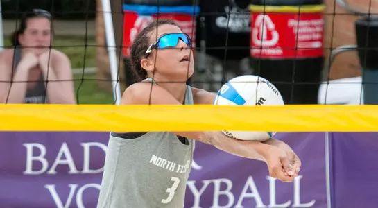 UNF women's volleyball player passes the ball
