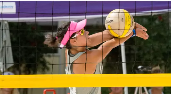 UNF volleyball player passes the ball