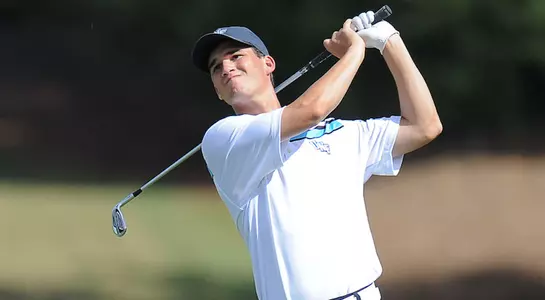 Philip Knowles watches his ball flight after hitting a shot from the fairway