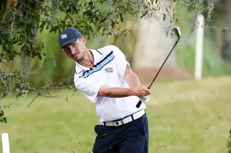 Travis Trace chipping a ball from the rough
