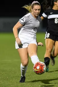 UNF women's soccer player strikes the ball