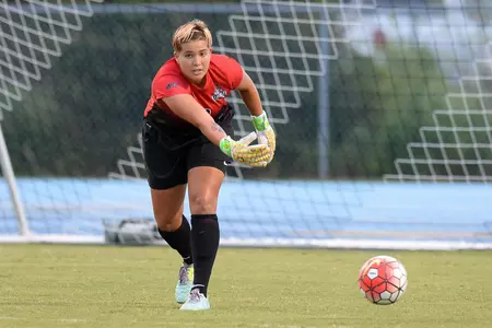 UNF women's soccer goalie gets ready to punt the ball