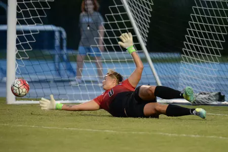 UNF women's soccer goalie dives for the ball