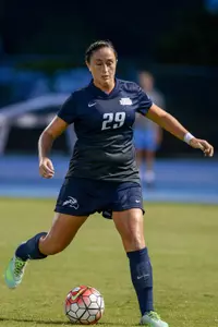 UNF women's soccer player gets ready to strike the ball