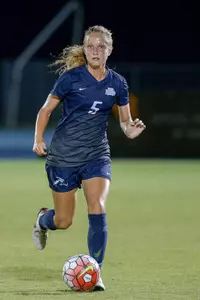 UNF women's soccer player assess the field for next move