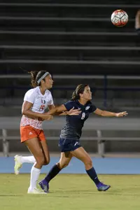 UNF women's soccer player fight for possession of the ball against opponent