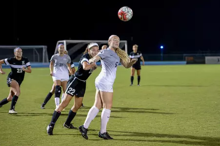 UNF women's soccer player heads the ball
