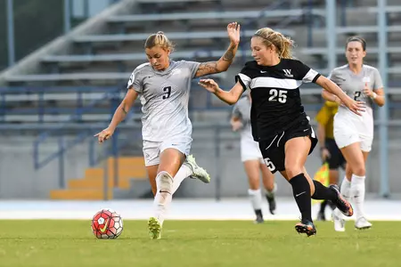 UNF women's soccer player strikes the ball
