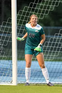 UNF women's soccer goalie prepares for foul kick