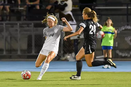 UNF women's soccer player strikes the ball