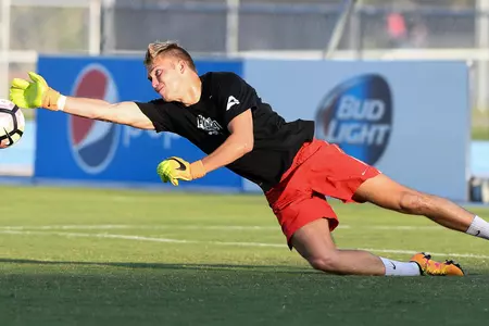 UNF men's soccer goalie makes a diving save