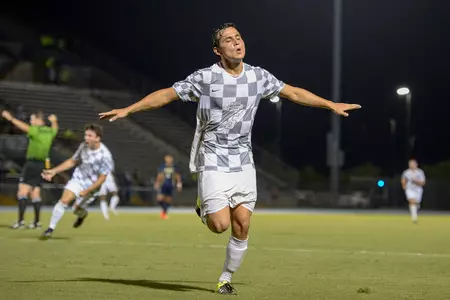UNF men's soccer player cheer after goal