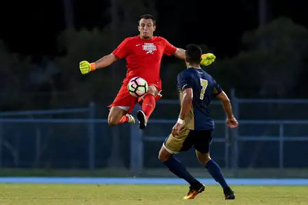 UNF men's soccer goalie makes a jump kick