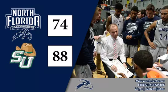 UNF basketball team huddle around head coach Matthew Driscoll at Stetson Game. Ospreys lost game 88-74.