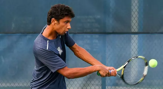Sahil Deshmukh hits a forehand at tennis.